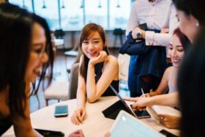 Coworkers working together on a project in the office